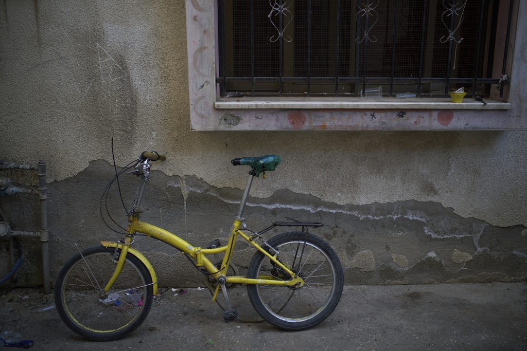 The bicycle of Saddam Rajab, a 10-year-old who was killed by an Israeli soldier, sits outside his mother's house in the West Bank city of Tulkarem, March 17, 2025. (AP Photo/Leo Correa)