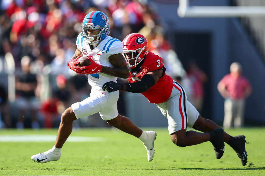 Mississippi wide receiver Harrison Wallace III (2) catches a pass against Georgia linebacker CJ Allen (3) during the first half of an NCAA college football game Saturday, Oct. 18, 2025, in Athens, Ga. (AP Photo/Colin Hubbard)