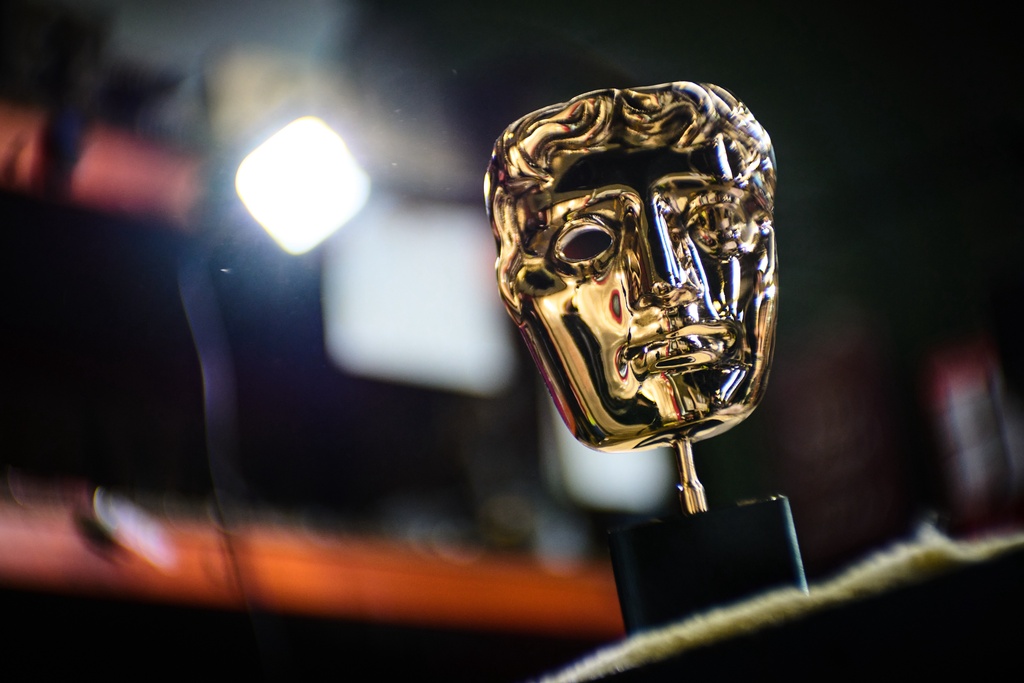 A completed British Academy Film Awards mask sits on a workbench at the FSE Foundry in Braintree, England on Tuesday, Feb. 10, 2026. (Scott A Garfitt/Invision/AP)
