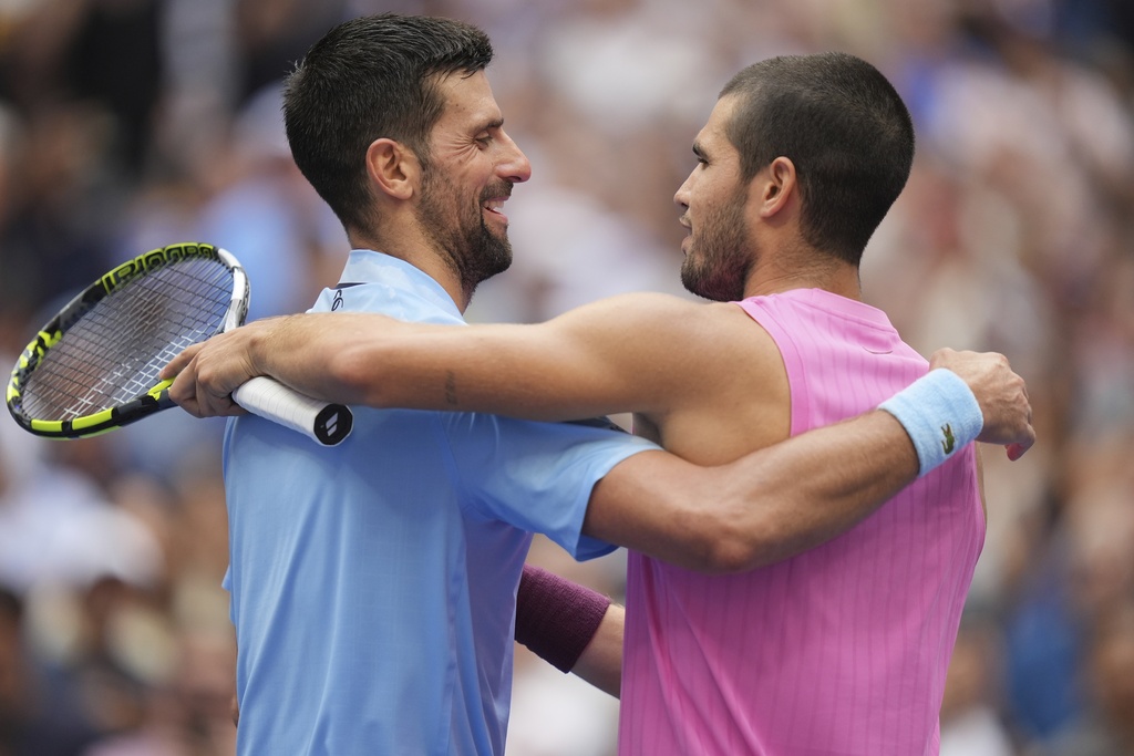 Novak Djokovic, of Serbia, congratulates Carlos Alcaraz, of Spain, after their the men's singles semifinals of the U.S. Open tennis championships, Friday, Sept. 5, 2025, in New York. (AP Photo/Seth Wenig)