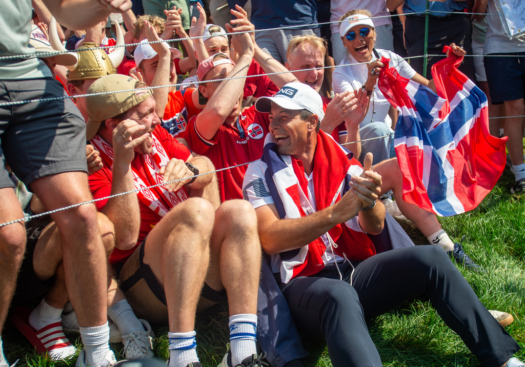 Viktor Hovland celebrates his victory with fellow Norwegians as they do the Viking Row on the 18th green after winning a playoff at the 2026 Travelers Championship at TPC River Highlands in Cromwell, Conn., Monday, June 29, 2026. (Aaron Flaum/Hartford Courant via AP)