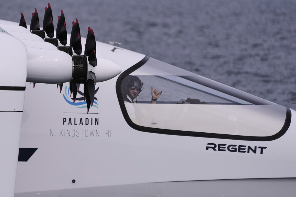 Billy Thalheimer, CEO and Co-Founder of REGENT, gestures after piloting the Viceroy Seaglider, a winged passenger ferry, following a test run on Narragansett Bay, Wednesday, Aug. 6, 2025, off the coast of North Kingstown, R.I. (AP Photo/Charles Krupa)