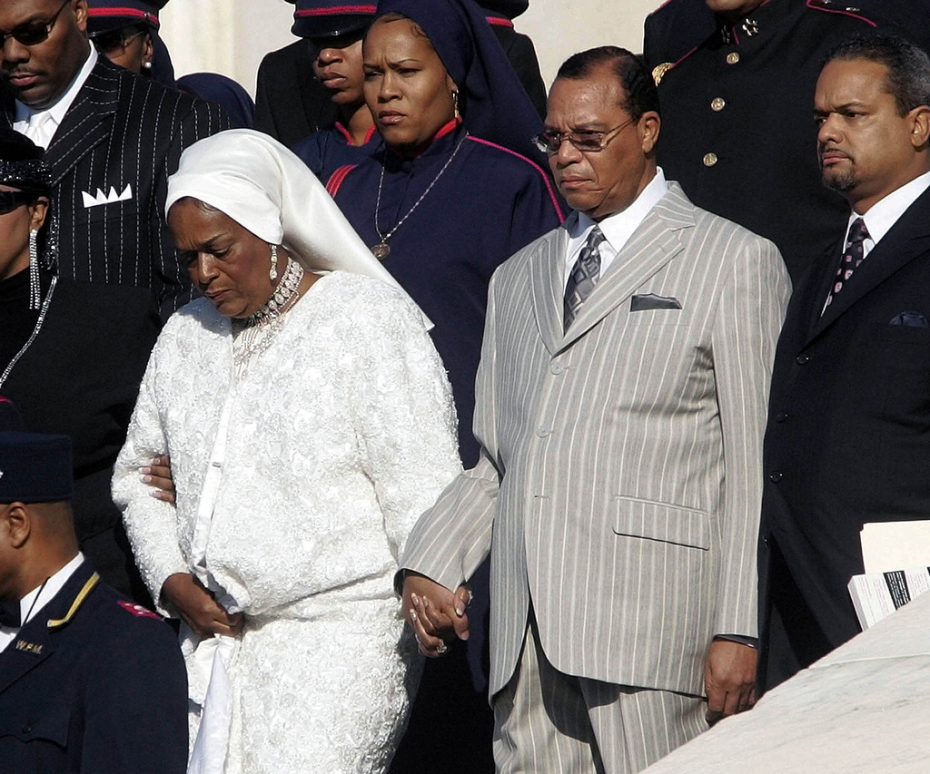 FILE - Nation of Islam leader Louis Farrakhan, center from Chicago, Il., walks down the steps of the Capital Building with his wife, Mother Khadijah Farrakhan, left, as they arrive at the Millions More Movement on the National Mall, Saturday, Oct. 15, 2005 in Washington. (AP Photo/Pablo Martinez Monsivais, File)