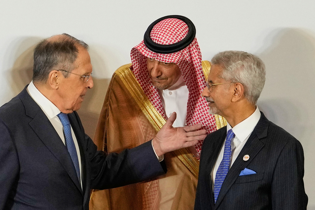Russia's Foreign Minister Sergey Lavrov, left, talks to Vice Minister of Foreign Affairs of Saudi Arabia, Waleed bin Abdulkarim, center, as Indian Foreign Minister S.Jaishankar, right, watches at a photo call of Government representatives and partner countries of BRICS during a two day meeting in New Delhi, India, Thursday, May 14, 2026. (AP Photo/Manish Swarup)