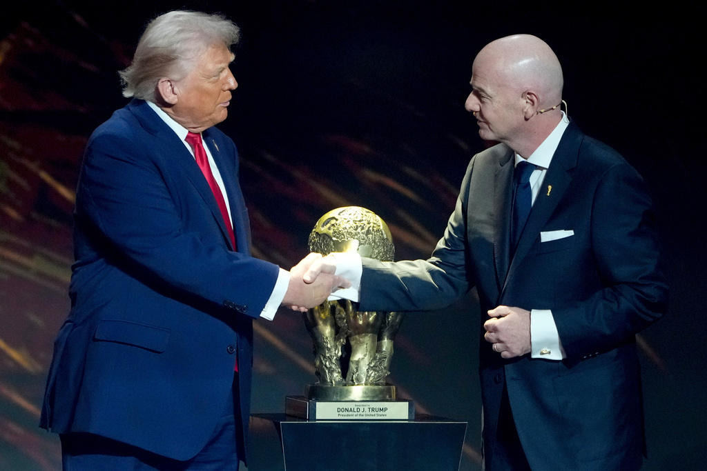 FILE - FIFA President Gianni Infantino, right, awards President Donald Trump with the FIFA Peace Prize during the draw for the 2026 soccer World Cup at the Kennedy Center in Washington, Friday, Dec. 5, 2025. (AP Photo/Chris Carlson, File)