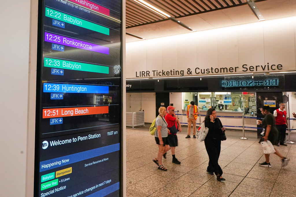 Departure times for Long Island Rail Road trains are displayed in Penn Station, in New York, Tuesday, May 19, 2026. (AP Photo/Richard Drew)