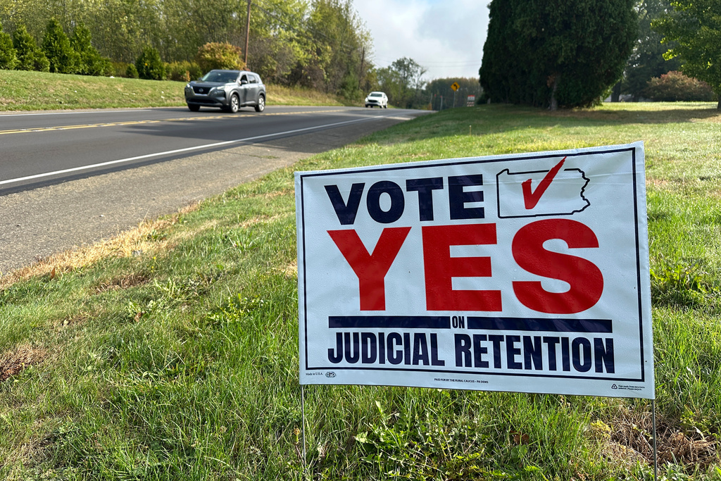 A campaign sign in favor of retaining three Democratic Pennsylvania Supreme Court Justices stands next to a road in Renfrew, Pa., Sunday, Sept. 28, 2025. (AP Photo/Robert Yoon)