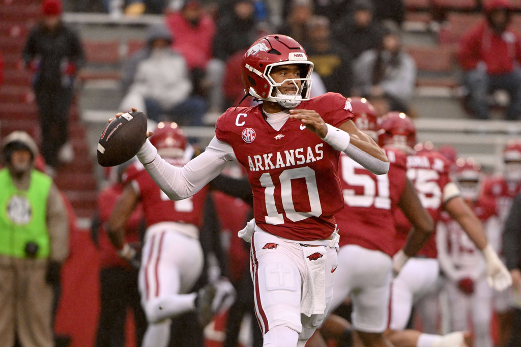 Arkansas quarterback Taylen Green (10) rolls out to pass against Missouri during the first half of an NCAA college football game, Saturday, Nov. 29, 2025, in Fayetteville, Ark. (AP Photo/Michael Woods)