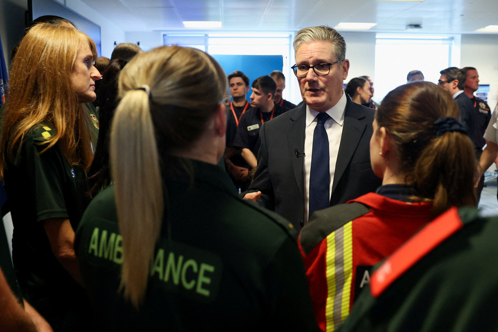 Britain's Prime Minister Keir Starmer meets emergency services workers at the Greater Manchester Police headquarters in Manchester, England, Friday, Oct. 3, 2025, after multiple people were killed Thursday on Yom Kippur in what police have declared a terrorist incident. (Phil Noble/Pool Photo via AP)