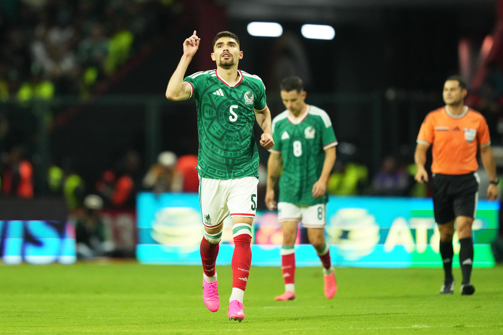 Mexico's Johan Vásquez (5) reacts after scoring his side's first goal against Serbia during an international friendly soccer match in Toluca, Mexico, Thursday, June 4, 2026. (AP Photo/Moises Castillo)