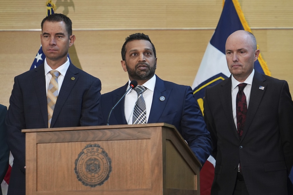 Kash Patel speaks at a news conference, Friday, Sept. 12, 2025, in Orem, Utah, as Utah department of public safety commissioner Beau Mason, left, and Utah Gov. Spencer Cox listen. (AP Photo/Lindsay Wasson)