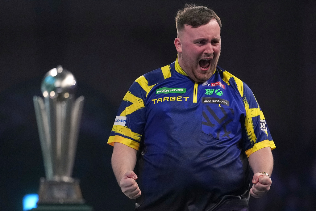 England's Luke Littler reacts after winning the World Darts Championships final match against Gian van Veen of the Netherlands at Alexandra Palace in London, Saturday, Jan. 3, 2026.(AP Photo/Dave Shopland)