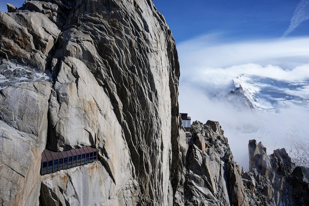 The Mont-Blanc massif mountains are seen from the Aiguille du Midi in Chamonix, France, Saturday, Sept. 5, 2026. (AP Photo/Laurent Cipriani)