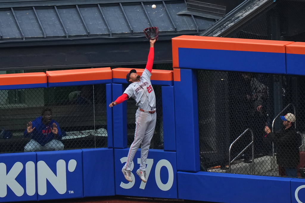 Washington Nationals' James Wood makes a leaping catch at the wall on a ball hit by New York Mets' Juan Soto during the first inning of a baseball game Thursday, April 30, 2026, in New York. (AP Photo/Frank Franklin II)