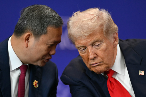 U.S. President Donald Trump listens to Cambodia's Prime Minister Hun Manet ahead of the ceremonial signing of a ceasefire agreement between Thailand and Cambodia on the sidelines of the 47th Association of Southeast Asian Nations (ASEAN) summit in Kuala Lumpur, Malaysia, Sunday, Oct. 26, 2025. (Mohd Rasfan/Pool Photo via AP) U.S. President Donald Trump listens to Cambodia's Prime Minister Hun Manet ahead of the ceremonial signing of a ceasefire agreement between Thailand and Cambodia on the sidelines of the 47th Association of Southeast Asian Nations (ASEAN) summit in Kuala Lumpur, Malaysia, Sunday, Oct. 26, 2025. (Mohd Rasfan/Pool Photo via AP)
