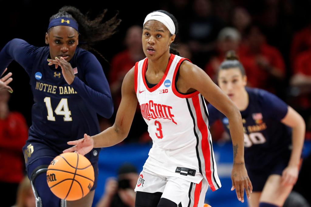 FILE - Ohio State guard Kennedy Cambridge (3) brings the ball downcourt past Notre Dame guard KK Bransford (14) during the first half in the second round of the NCAA college basketball tournament, March 23, 2026, in Columbus, Ohio. (AP Photo/Tom E. Puskar, File)