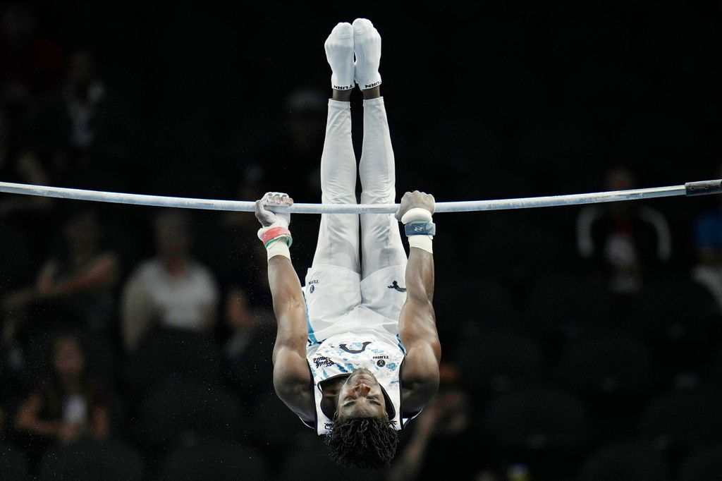 Fred Richard competes in the men's high bar during the U.S. Gymnastics Championships, Thursday, Aug. 6, 2026, in Phoenix. (AP Photo/Ross D. Franklin)