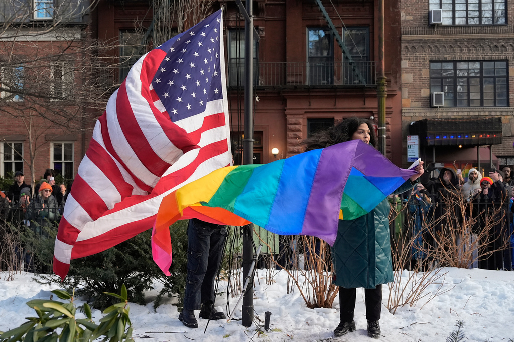 New York politicians and activists prepare to raise a rainbow flag on a pole in Christopher Park across the street from the Stonewall Inn, Thursday, Feb. 12, 2026, in New York, a few days after it was removed by the National Park Service to comply with guidance from the Trump administration. (AP Photo/Yuki Iwamura)