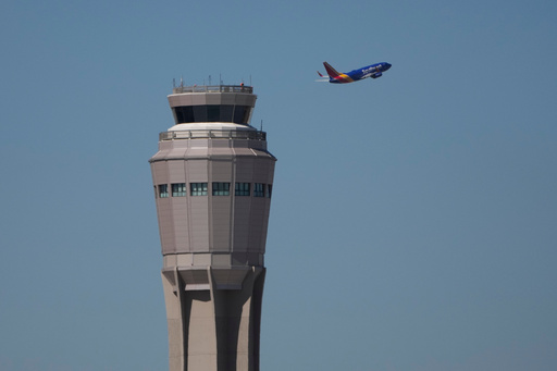A plane takes off near the air traffic control tower at Harry Reid International Airport, Tuesday, Oct. 7, 2025, in Las Vegas. (AP Photo/John Locher) A plane takes off near the air traffic control tower at Harry Reid International Airport, Tuesday, Oct. 7, 2025, in Las Vegas. (AP Photo/John Locher)