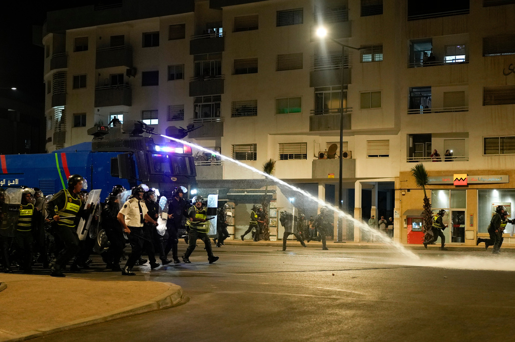 Security forces disperse a gathering as youth led protests calling for healthcare and education reforms turned violent, in Sale, Morocco, Wednesday, Oct. 1, 2025. (AP Photo/Mosa'ab Elshamy)