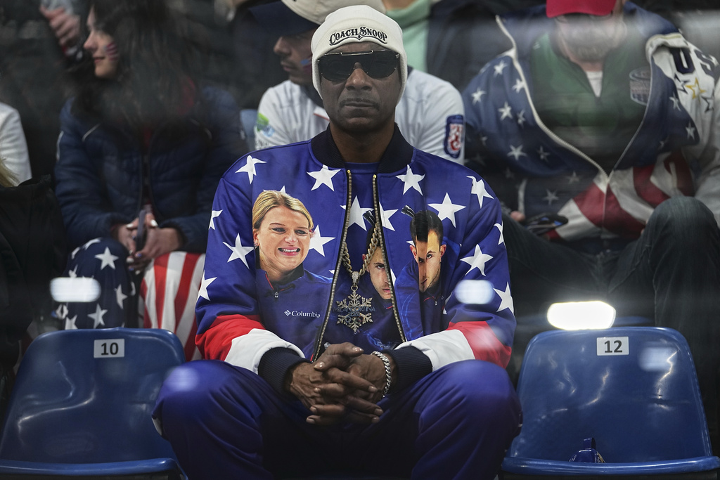 Rapper Snoop Dogg attends the mixed doubles round robin phase of the curling competition between the United States and Canada at the 2026 Winter Olympics, in Cortina d'Ampezzo, Italy, Friday, Feb. 6, 2026. (AP Photo/Fatima Shbair)