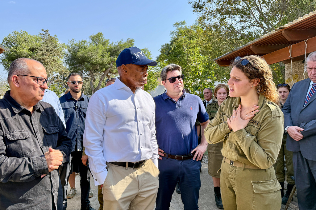 This image released by the Mayoral Photography Office shows New York Mayor Eric Adams, second left, during his visit to Kibbutz Kfar Aza, Nov. 18, 2025, which was attacked during the October 7th terrorist attacks on Israel. (Benny Polatseck/Mayoral Photography Office via AP)