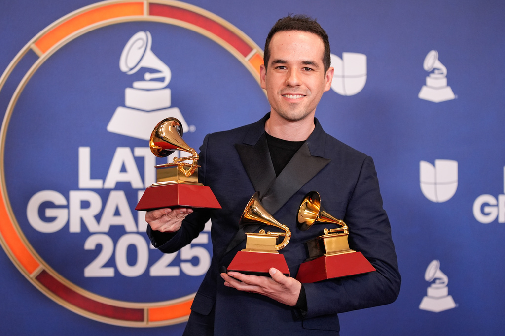 FILE - Edgar Barrera, winner of the awards for best tropical song and song of the year for "Si Antes Te Hubiera Conocido," and award for songwriter of the year, poses in the press room during the 2025 Latin Grammys in Las Vegas on Nov. 13, 2025. (AP Photo/John Locher, File)