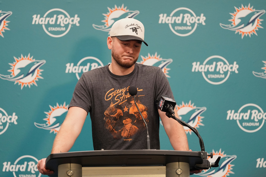 Miami Dolphins quarterback Quinn Ewers pauses during a news conference following a loss to the Cincinnati Bengals in an NFL football game, Sunday, Dec. 21, 2025, in Miami Gardens, Fla. (AP Photo/Rebecca Blackwell)