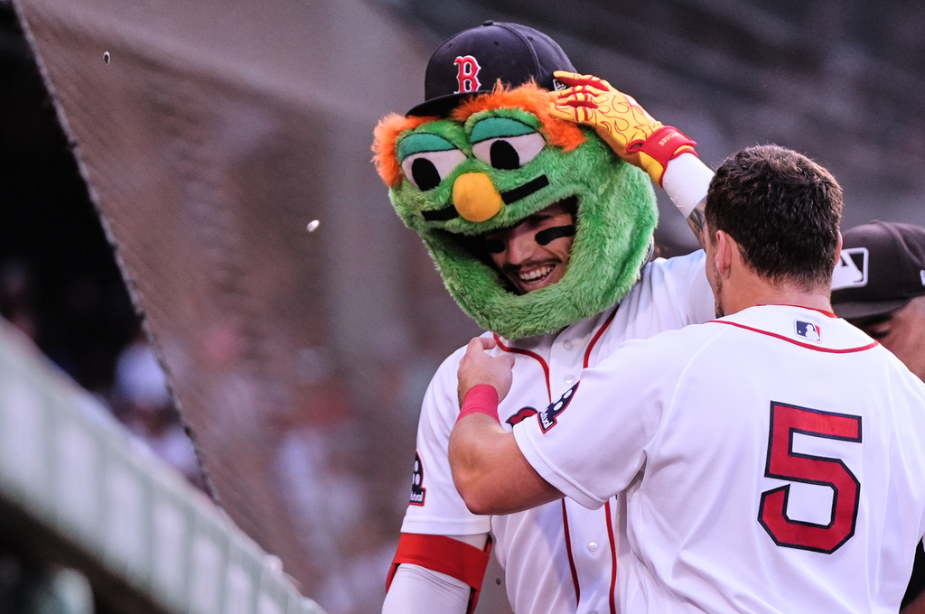 Boston Red Sox's Jarren Duran is congratulated by Caleb Durbin (5) after his solo home run during the first inning a baseball game against the Chicago White Sox, Tuesday, Aug. 4, 2026, in Boston. (AP Photo/Charles Krupa)