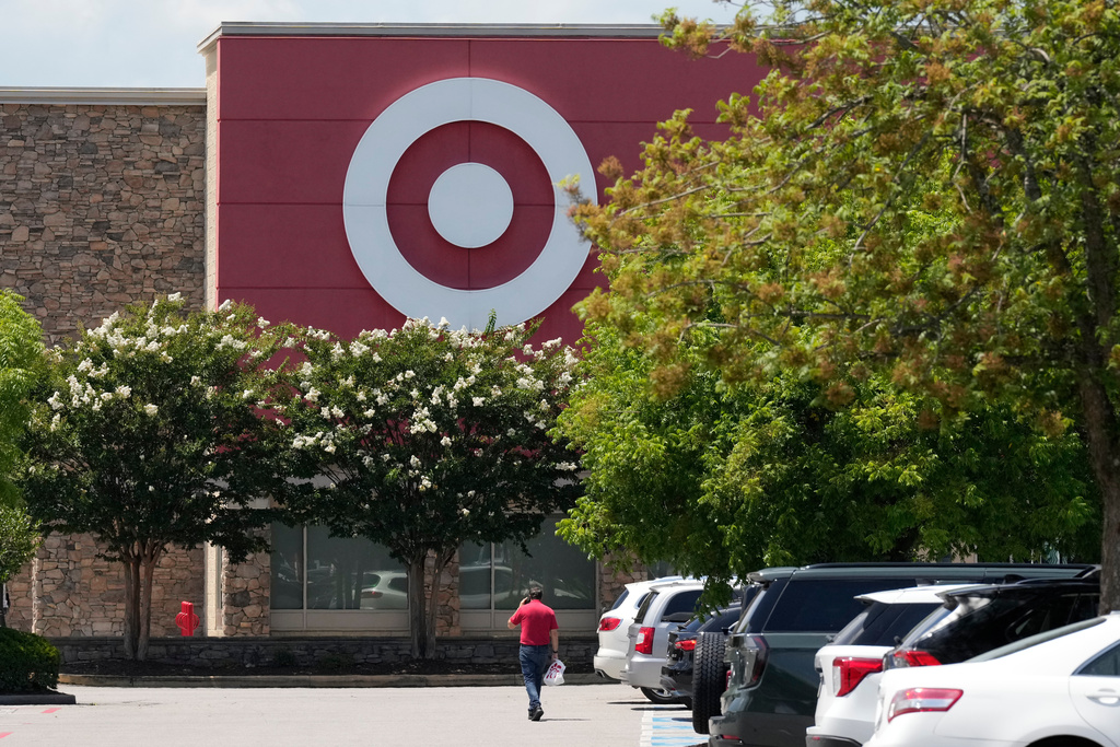 FILE - A person walks towards a Target store, July 15, 2025, in Nashville, Tenn. (AP Photo/George Walker IV, File)