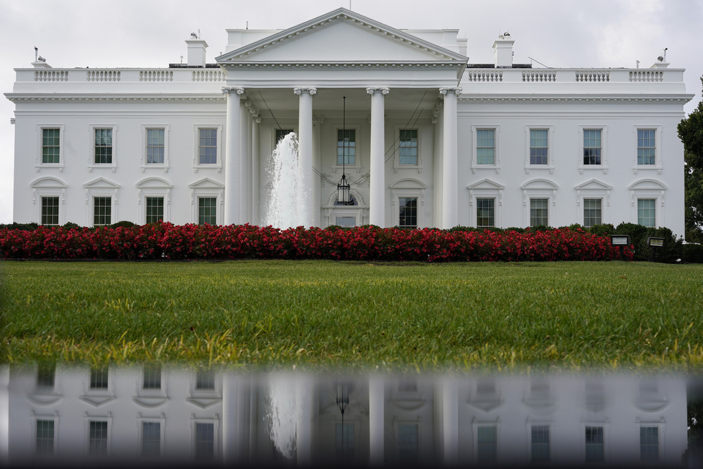 FILE - The White House is seen reflected in a puddle, Saturday, Sept. 3, 2022, in Washington. (AP Photo/Carolyn Kaster, File)