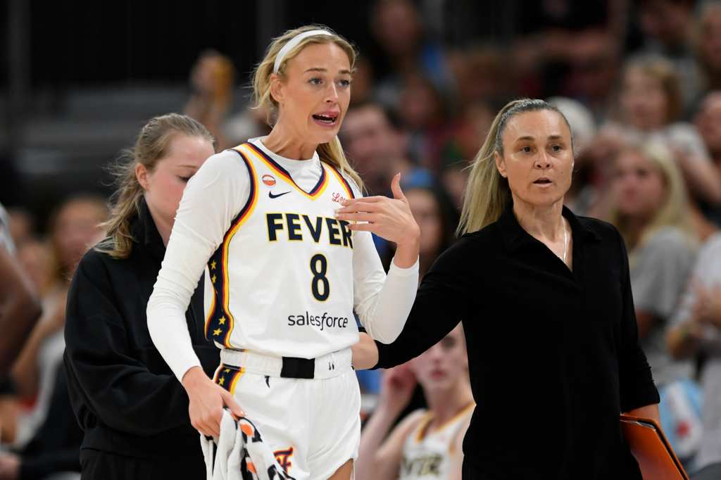 Indiana Fever's Sophie Cunningham (8) reacts while talking to the Chicago Sky bench after being fouled during the first half of an WNBA basketball game in Chicago, Saturday, Aug. 8, 2026. (AP Photo/Paul Beaty)