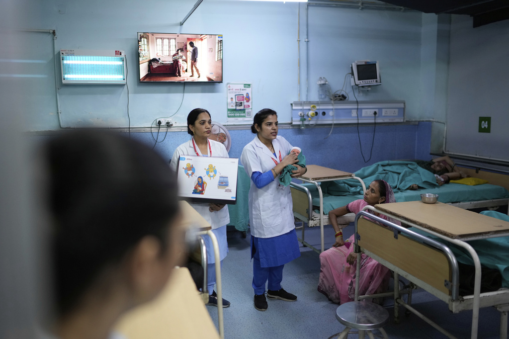 Nurses brief pregnant mothers and their caregivers about antenatal Care Companion Program (CCP) in a maternity ward of a government hospital in Gurugram, a satellite city of New Delhi, India, on Aug. 7, 2025. (AP Photo/Manish Swarup)