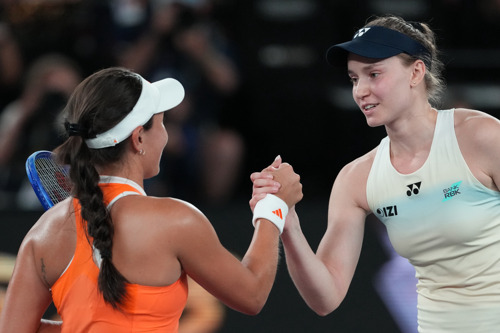 Elena Rybakina, right, of Kazakhstan is congratulated by Jessica Pegula, left, of the U.S. following their semifinal match at the Australian Open tennis championship in Melbourne, Australia, Thursday, Jan. 29, 2026. (AP Photo/Aaron Favila)
