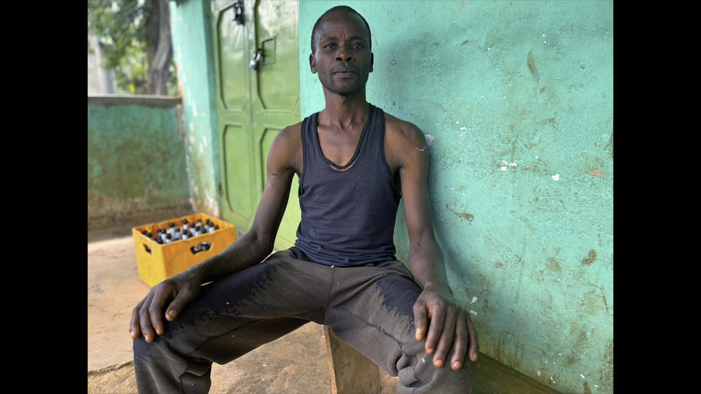 In this photo taken with a smartphone, David Nabutsilili, a rainmaker, poses for a photo in Namisindwa, Uganda, Tuesday, Sept. 3, 2026. (AP Photo/Rodney Muhumuza)