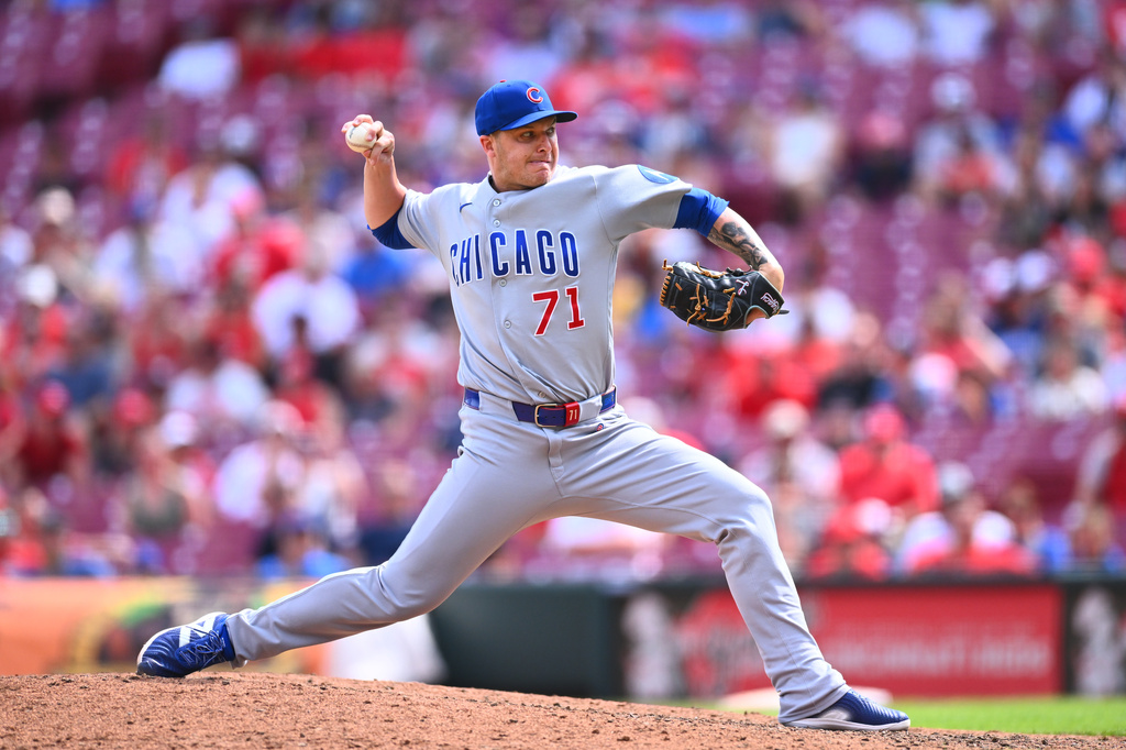 Chicago Cubs pitcher Jacob Webb throws during the ninth inning of a baseball game against the Cincinnati Reds in Cincinnati, Sunday, July 12, 2026. (AP Photo/Ben Jackson)