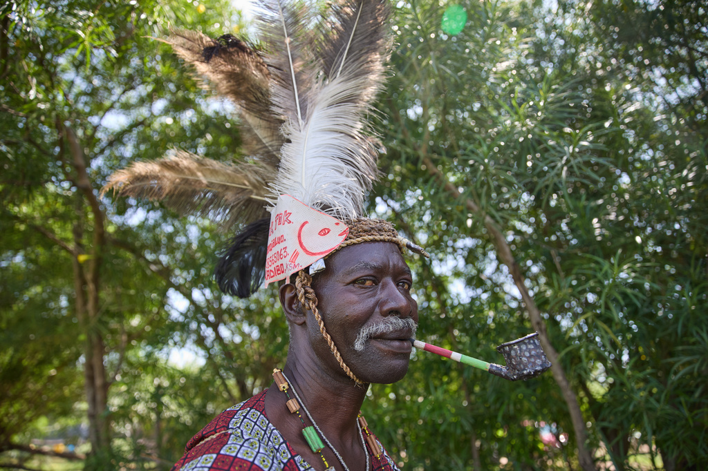Professional mourner James Ajowi, who has worked in the role for more than 20 years and says the work has taken on deeper meaning since the death of his daughter, stands on the outskirts of Kisumu, Kenya, Friday, March 13, 2026. (AP Photo/Asa Wallin)