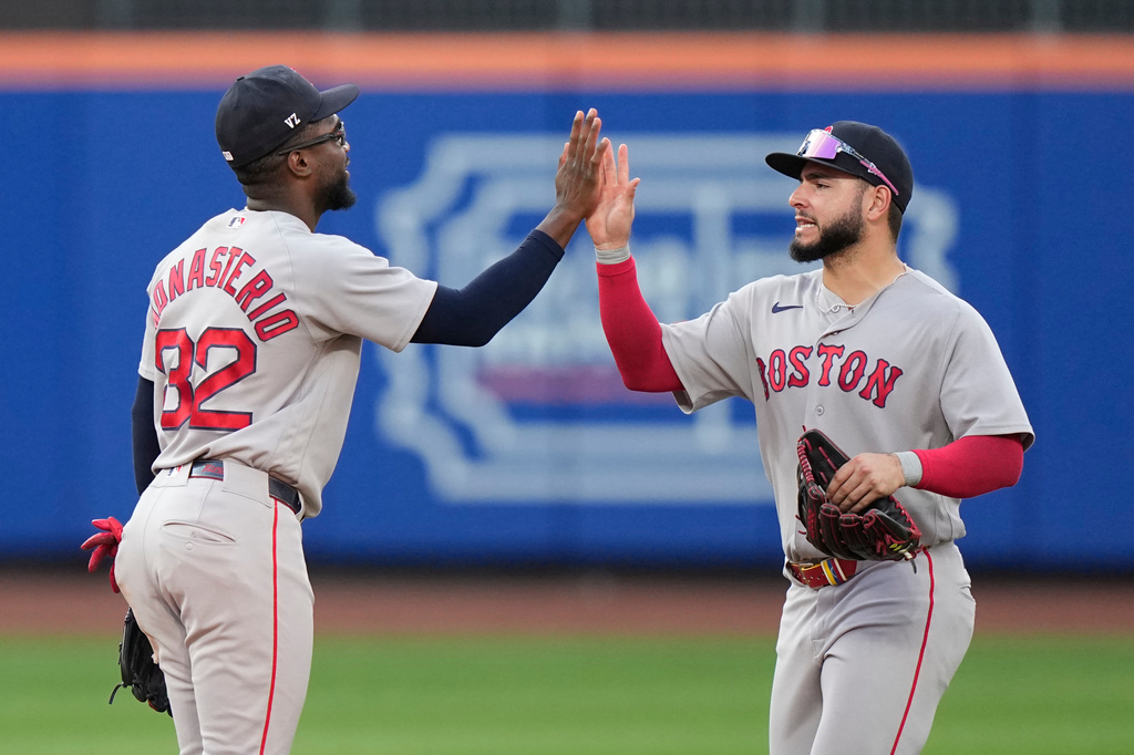Boston Red Sox's Andruw Monasterio, left, celebrates with Wilyer Abreu after of a baseball game against the New York Mets Saturday, July 11, 2026, in New York. (AP Photo/Frank Franklin II)