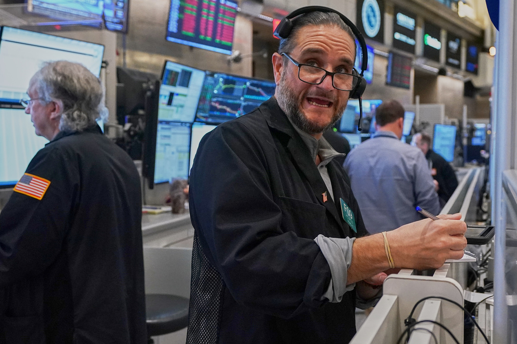 Options trader Chris Dattolo works on the floor of the New York Stock Exchange, Wednesday, May 13, 2026. (AP Photo/Richard Drew)