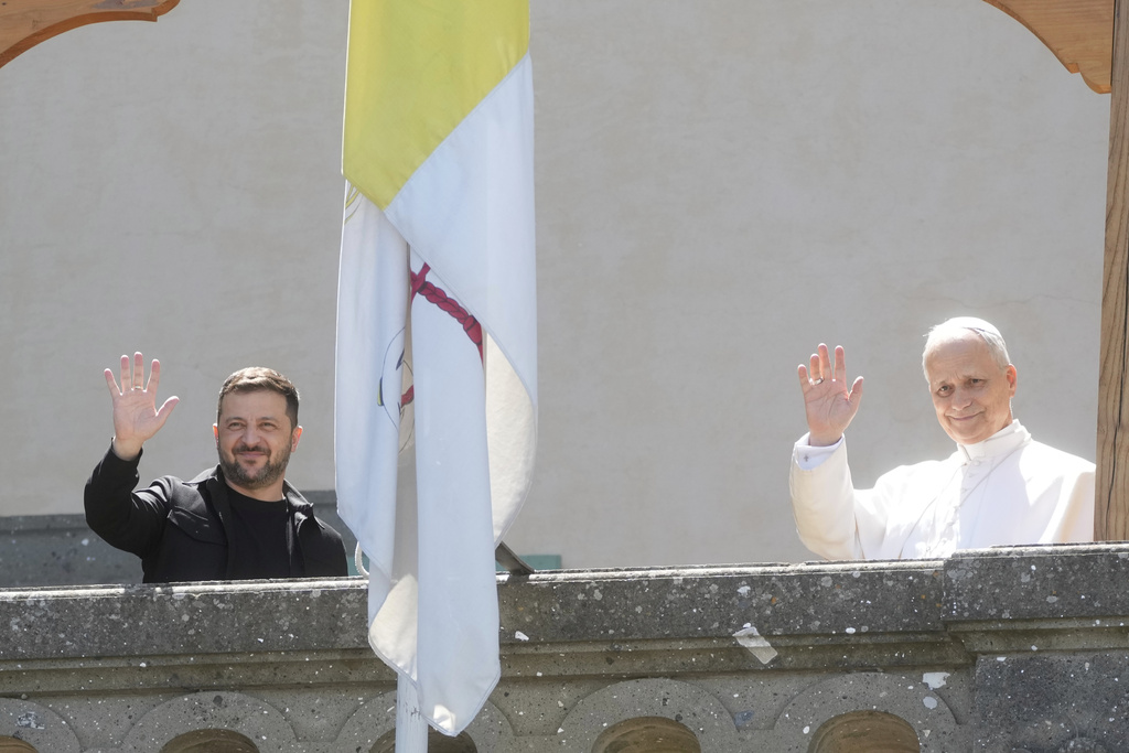 FILE - Ukraine President Volodymyr Zelenskyy, left, and Pope Leo XIV wave to journalists during their meeting in Castel Gandolfo, Italy, Wednesday, July 9, 2025. (AP Photo/Gregorio Borgia, File)