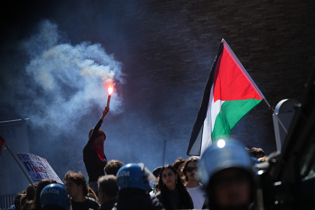 Pro-Palestinian demonstrators gather for a national general strike called by different unions to protest against the situation in Gaza two days after Israeli forces intercepted a Gaza-bound aid flotilla in the Mediterranean Sea, in Rome, Friday, Oct. 3, 2025. (AP Photo/Alessandra Tarantino)