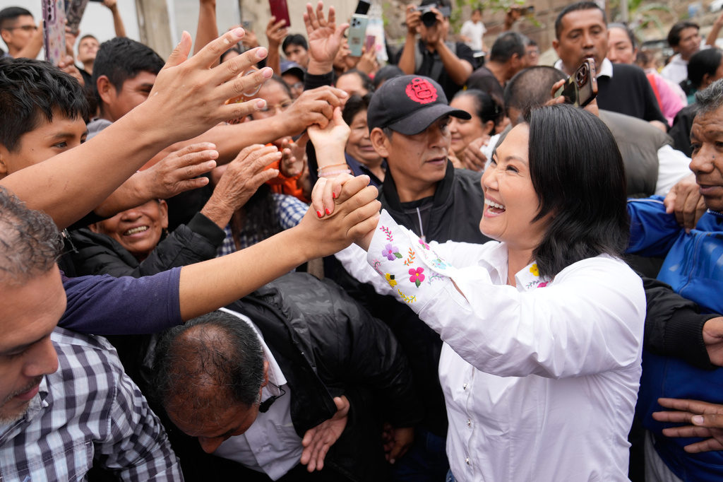 Presidential candidate Keiko Fujimori, of the Popular Force party, greets supporters before voting in the presidential runoff election in Lima, Peru, Sunday, June 7, 2026. (AP Photo/Martin Mejia)