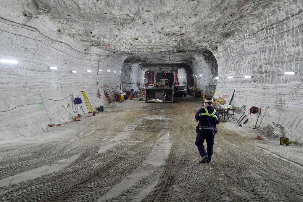 George Campbell, maintenance supervisor, walks down an incline in the shop at the Cargill salt mine on Whiskey Island in Cleveland, Ohio, Thursday, March 19, 2026. (AP Photo/Sue Ogrocki)