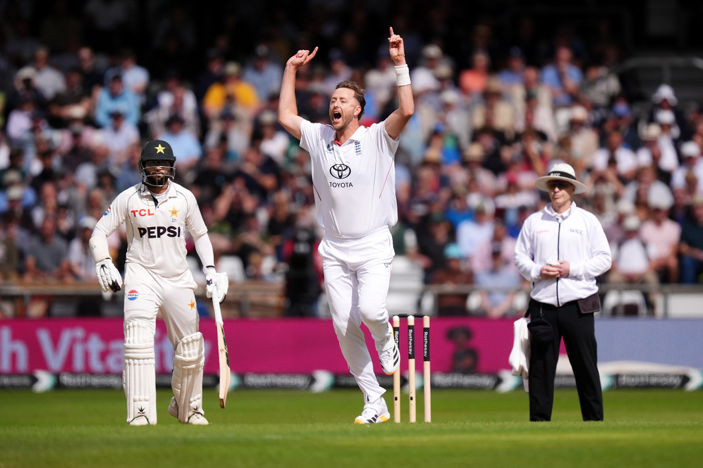 England's Ollie Robinson celebrates bowling out Pakistan's Azan Awais on day one of the first Rothesay Test match between England and Pakistan in Leeds, England, Wednesday, Aug. 19, 2026. (Mike Egerton/PA via AP)