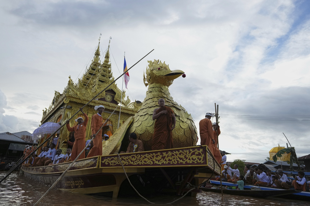 A huge barge carrying Buddha statues floats during the Phaung Daw Oo pagoda festival in Inle Lake, southern Shan State, Myanmar, Tuesday, Sept. 23, 2025. (AP Photo/Thein Zaw)