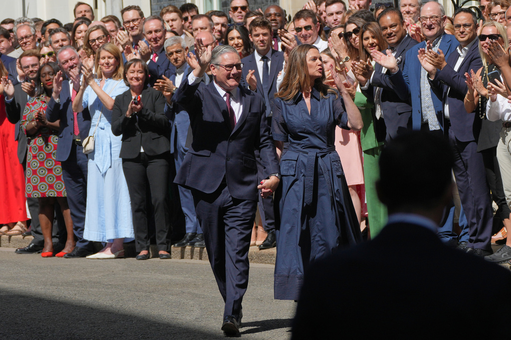 Britain's outgoing Prime Minister Keir Starmer and wife Victoria wave as they leave 10 Downing Street in London, Monday, July 20, 2026.(AP Photo/Kin Cheung)