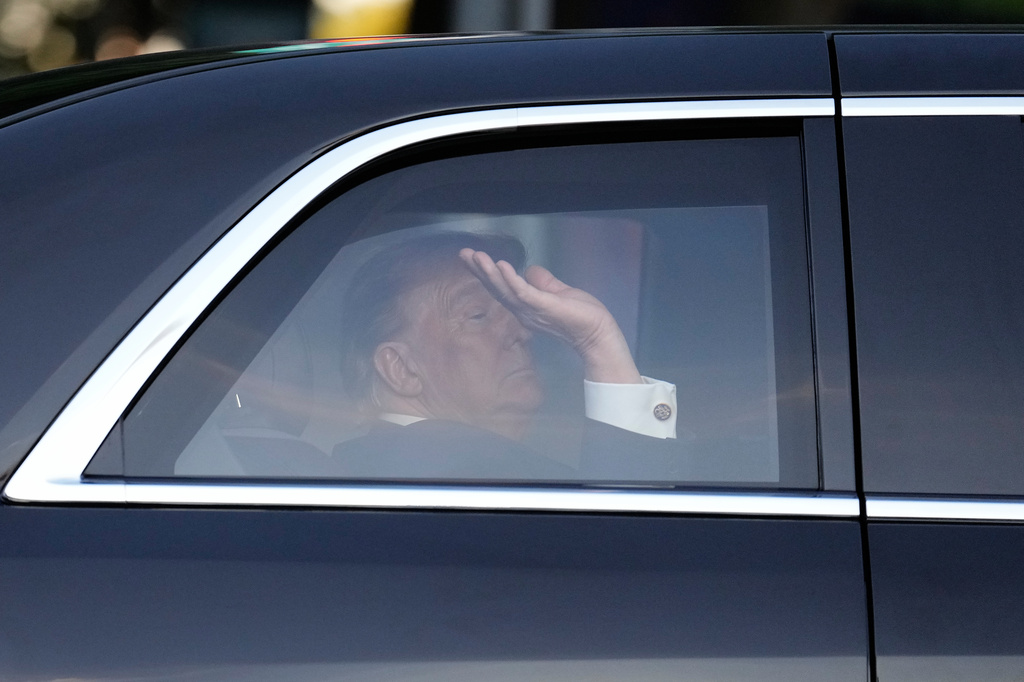 President Donald Trump waves from his motorcade vehicle as he arrives at the opening of the Great American State Fair on the National Mall, Wednesday, June 24, 2026, in Washington. (AP Photo/Carolyn Kaster)