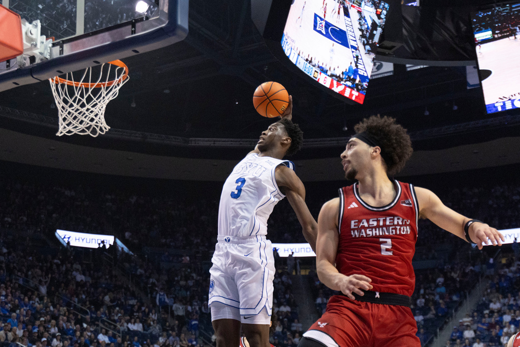 BYU forward AJ Dybantsa (3) prepares to dunk against Eastern Washington guard Isaiah Moses (2) during the first half of an NCAA basketball game, Monday, Dec. 22, 2025, in Provo, Utah. (AP Photo/Rob Gray)