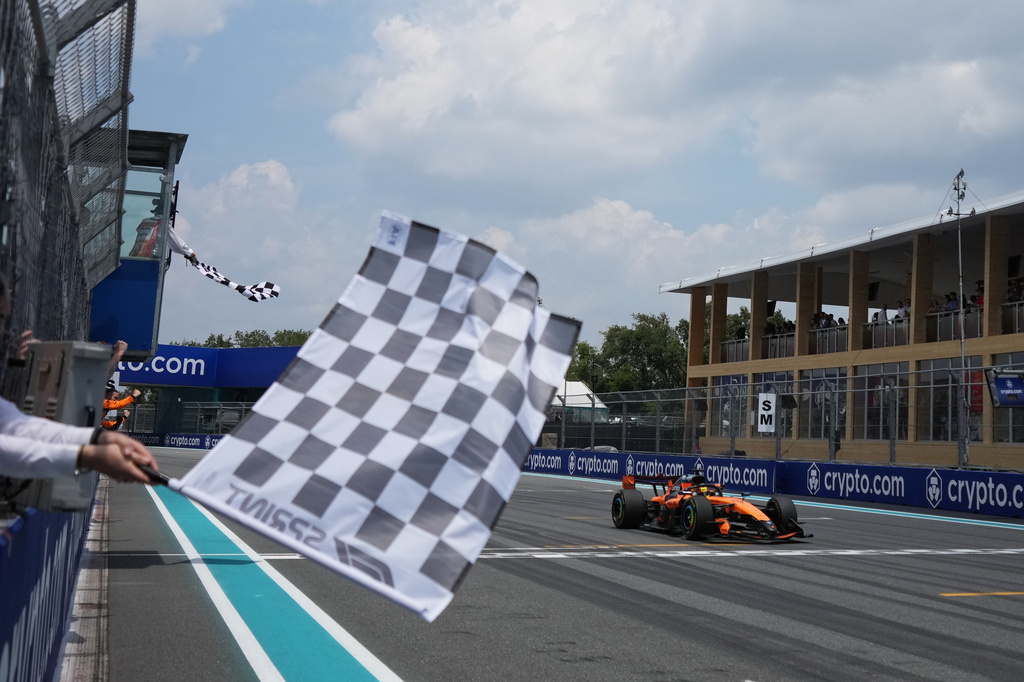 McLaren driver Oscar Piastri of Australia crosses the finish line during a sprint auto race at the Miami Formula One Grand Prix, Saturday, May 2, 2026, in Miami Gardens, Fla. (AP Photo/Rebecca Blackwell, Pool)
