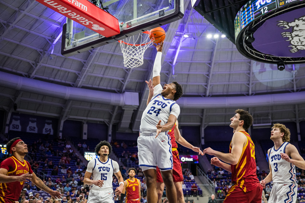 TCU forward Xavier Edmonds (24) drives the ball during an NCAA college basketball game against Iowa State, Tuesday, Feb. 10, 2026, Fort Worth, Texas. (AP Photo/Jessica Tobias)